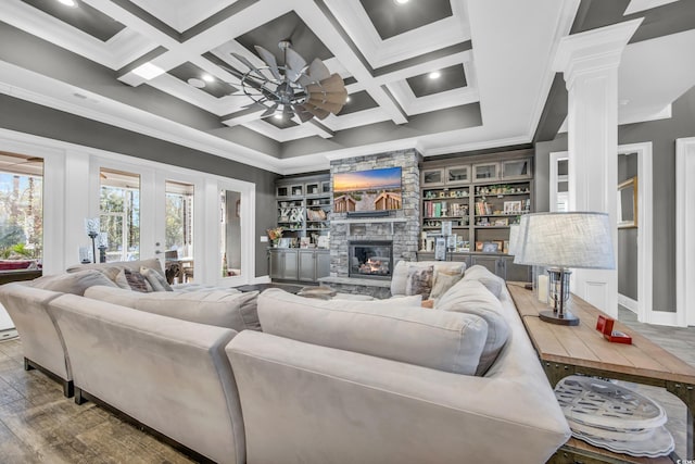 living room featuring wood-type flooring, coffered ceiling, and beam ceiling