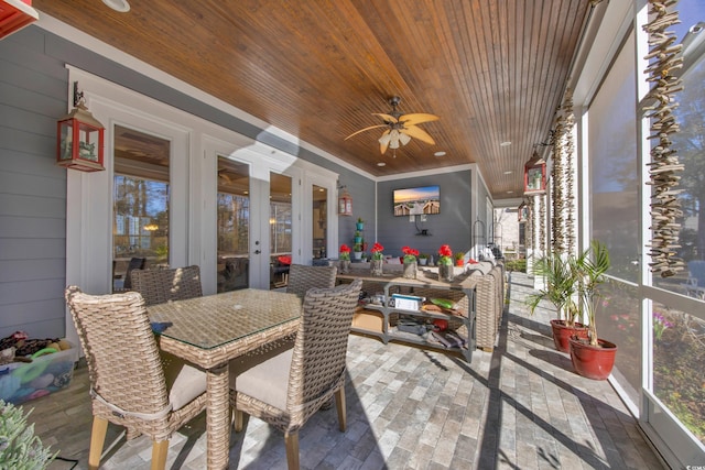 sunroom featuring wooden ceiling, french doors, and ceiling fan