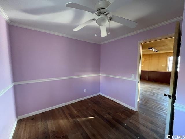 unfurnished room with ceiling fan, dark wood-type flooring, and crown molding