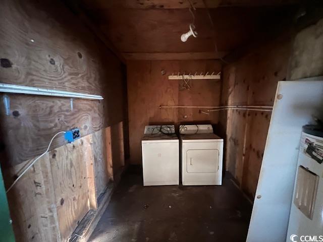 clothes washing area featuring separate washer and dryer