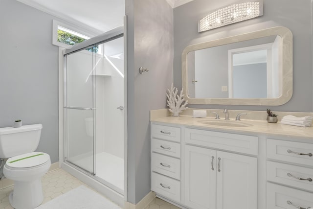 bathroom with tile patterned floors, an enclosed shower, vanity, and toilet