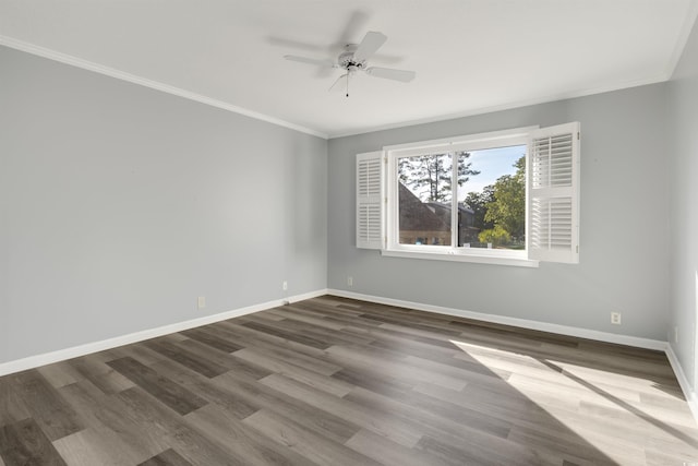 empty room featuring ceiling fan, dark hardwood / wood-style flooring, and crown molding