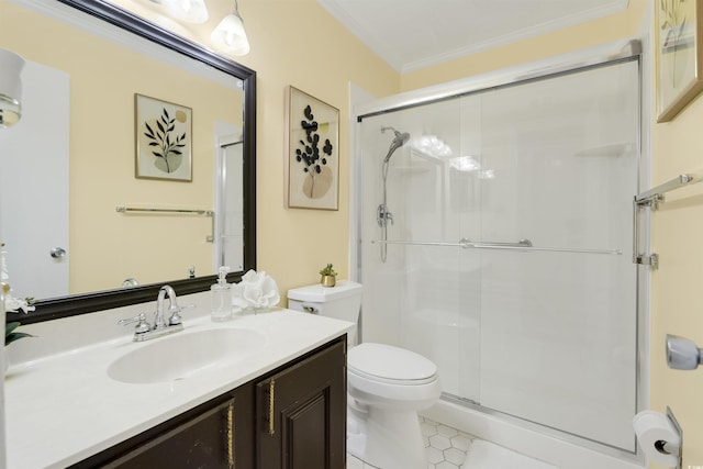 bathroom featuring tile patterned flooring, vanity, toilet, walk in shower, and ornamental molding