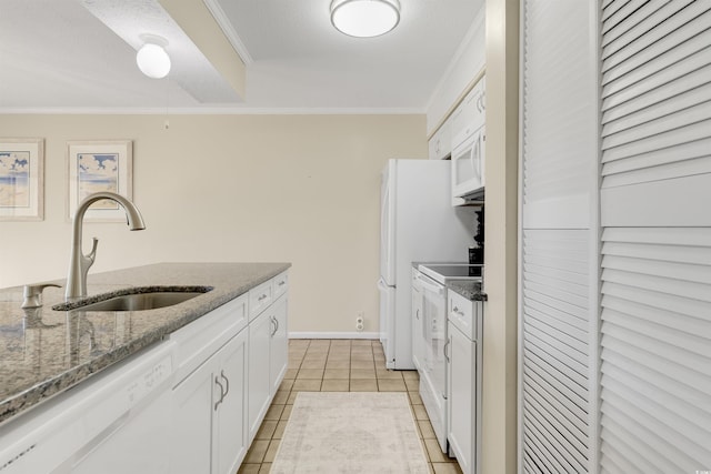 kitchen with crown molding, sink, white appliances, and white cabinetry