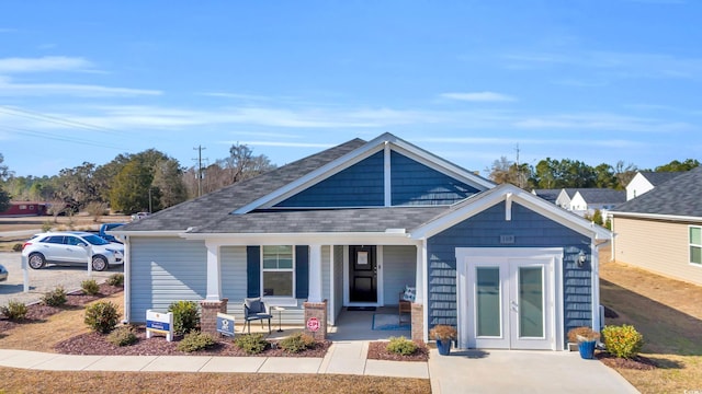 view of front of property with french doors and covered porch