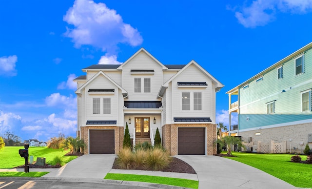 view of front facade with a front yard and a garage