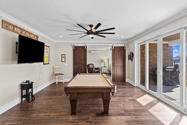 playroom with ceiling fan, a barn door, billiards, ornamental molding, and dark hardwood / wood-style flooring