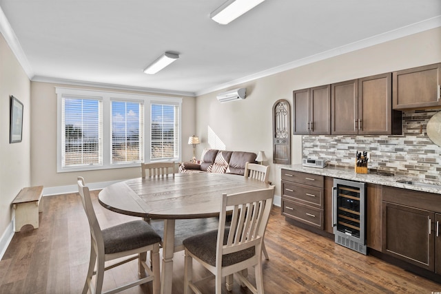 dining area with dark hardwood / wood-style flooring, crown molding, beverage cooler, and an AC wall unit