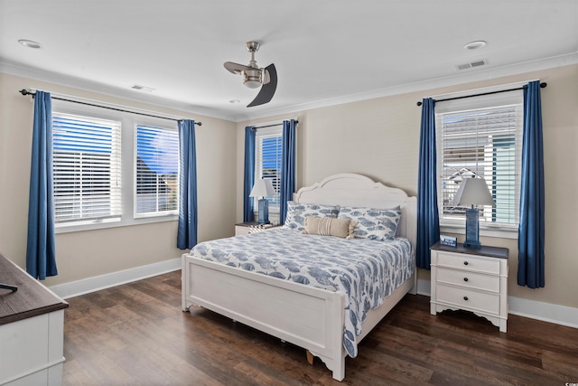 bedroom featuring ceiling fan, dark hardwood / wood-style floors, and ornamental molding