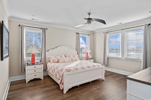 bedroom featuring ceiling fan, dark wood-type flooring, and crown molding