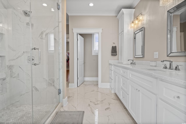 bathroom with a shower with shower door, vanity, and ornamental molding