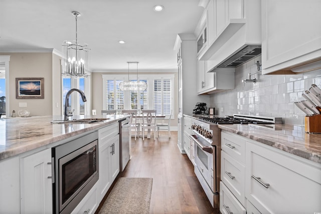 kitchen featuring white cabinets, sink, and stainless steel appliances