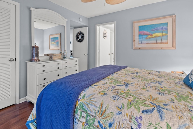 bedroom featuring dark hardwood / wood-style flooring and ceiling fan