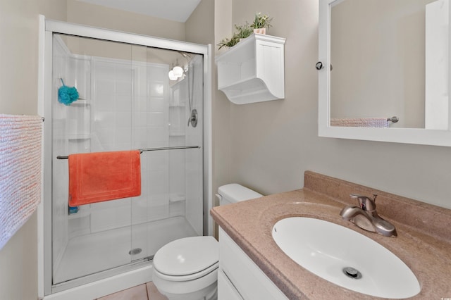 bathroom featuring walk in shower, vanity, and toilet