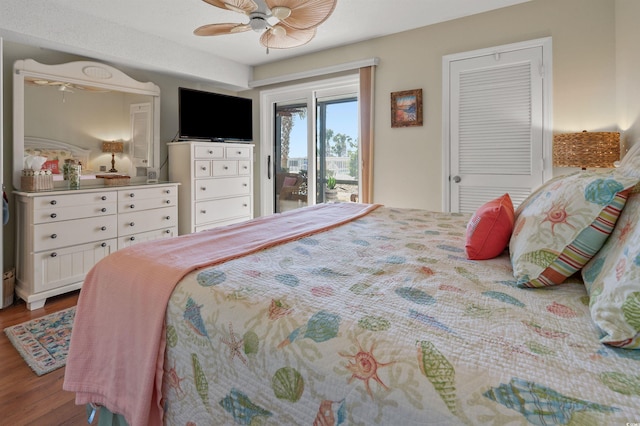 bedroom with ceiling fan, access to exterior, and hardwood / wood-style floors