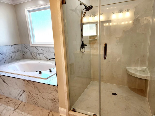 full bathroom featuring a garden tub and a shower stall