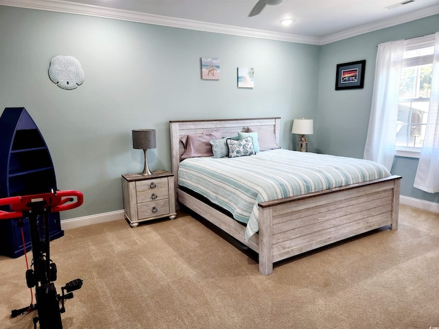 carpeted bedroom with baseboards, visible vents, ornamental molding, and ceiling fan