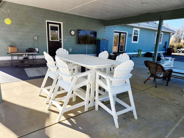 view of patio with french doors and outdoor dining space