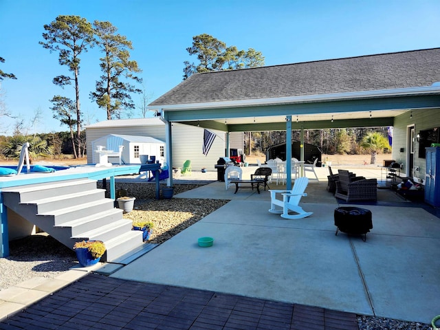 view of patio / terrace with a pool and outdoor lounge area