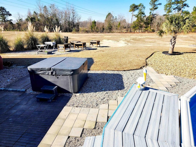 exterior space featuring a hot tub