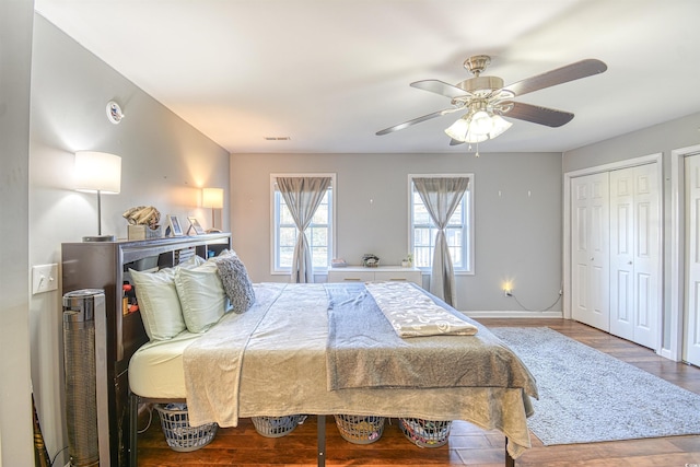 bedroom featuring ceiling fan, a closet, and hardwood / wood-style flooring