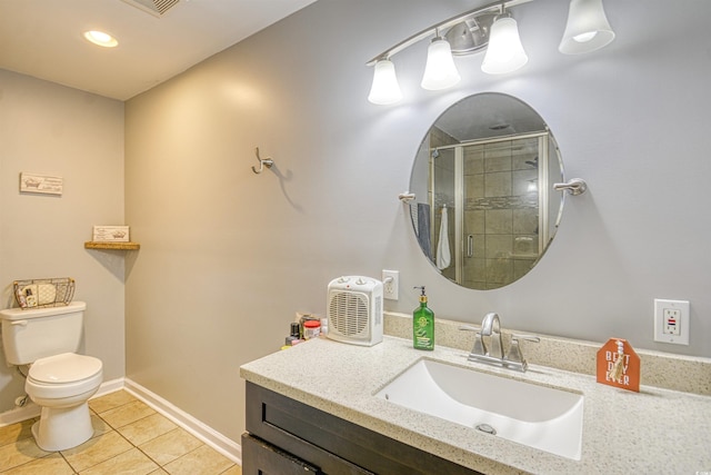 bathroom with tile patterned floors, a shower with door, toilet, and vanity