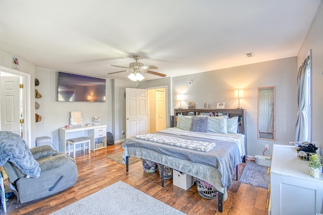 bedroom featuring ceiling fan and hardwood / wood-style flooring