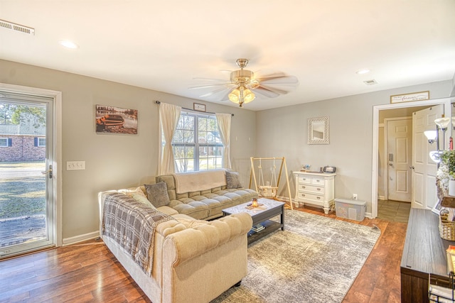 living room with ceiling fan and wood-type flooring