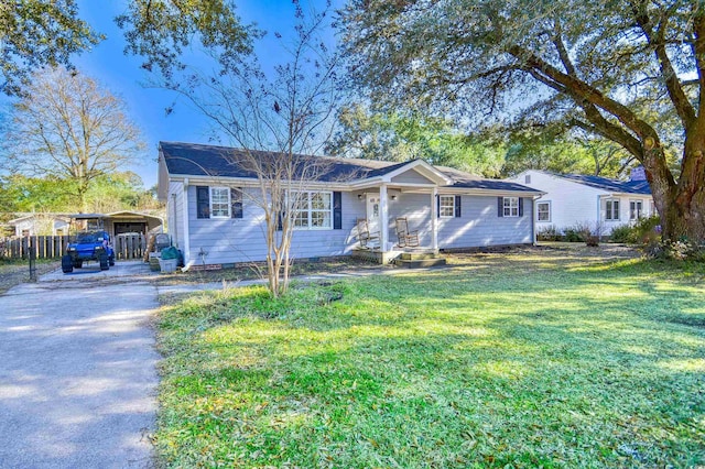 ranch-style house with a carport and a front yard