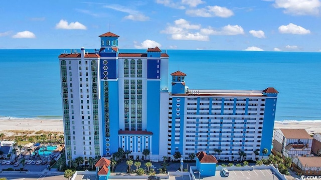 aerial view featuring a water view and a beach view