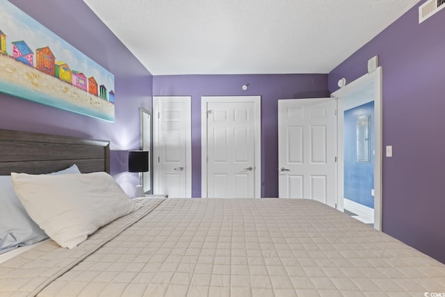 unfurnished bedroom with a textured ceiling