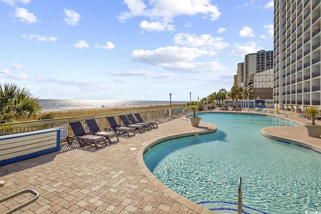 view of swimming pool with a patio