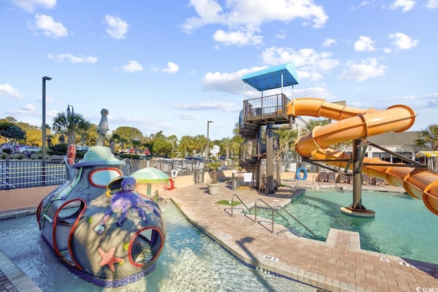 view of jungle gym with a community pool