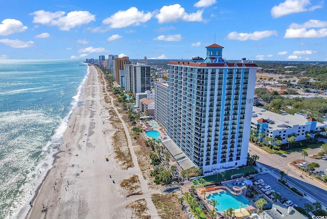 bird's eye view featuring a water view and a view of the beach