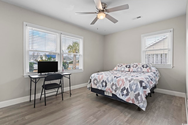 bedroom featuring ceiling fan and hardwood / wood-style floors