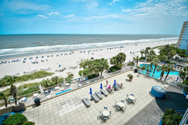 bird's eye view featuring a view of the beach and a water view