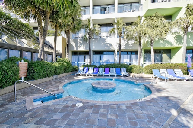 view of swimming pool with a patio