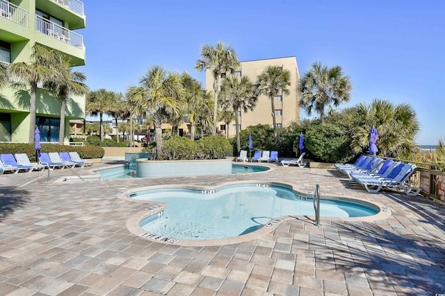 view of swimming pool with a patio