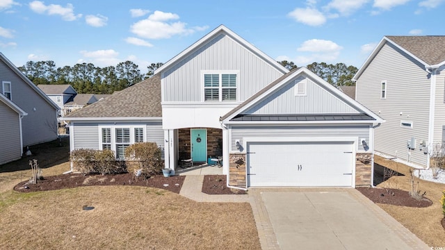 view of front facade with a garage and a front lawn