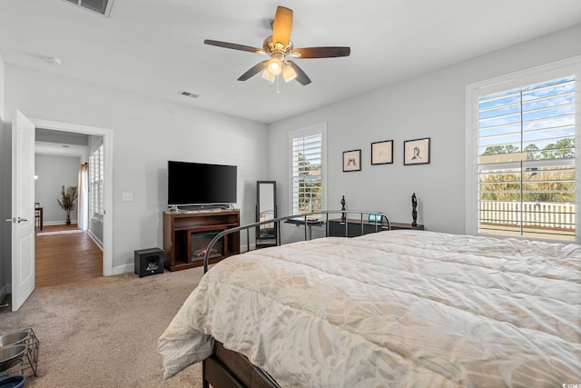 carpeted bedroom with ceiling fan