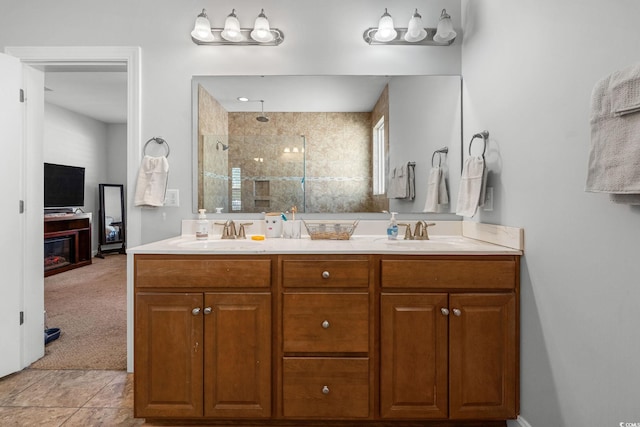 bathroom featuring vanity and a tile shower