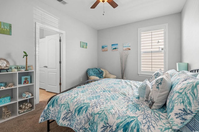 bedroom with light colored carpet and ceiling fan