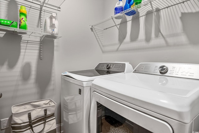 laundry area featuring washer and clothes dryer