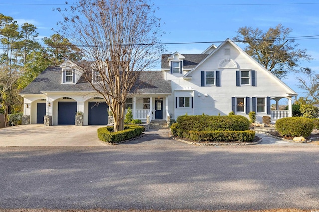 view of front of property with a porch and a garage