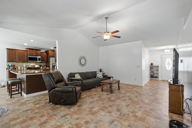 living room featuring vaulted ceiling and ceiling fan