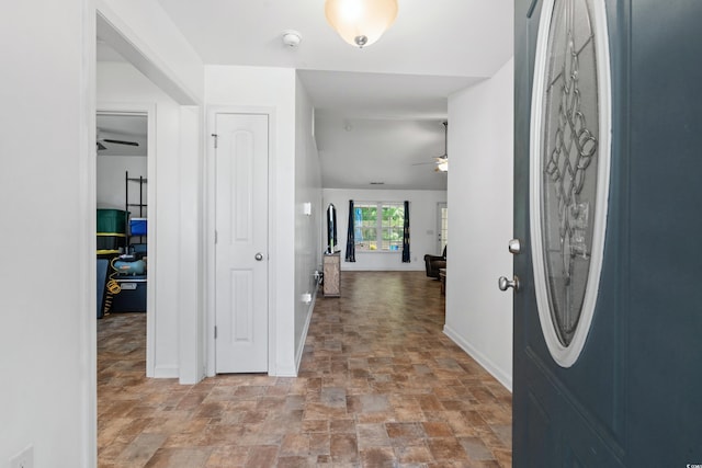 foyer featuring ceiling fan