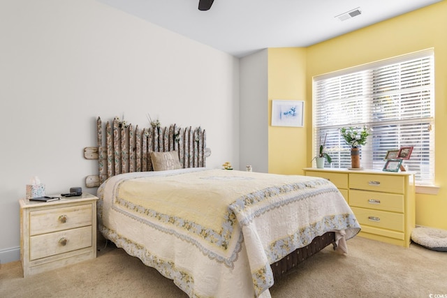 bedroom featuring ceiling fan and light colored carpet