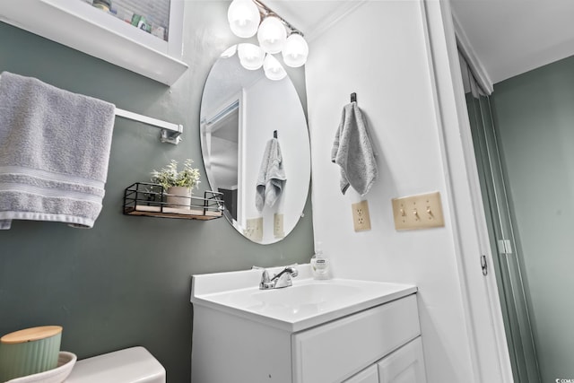 bathroom featuring toilet and vanity