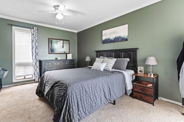 bedroom featuring ceiling fan, light colored carpet, crown molding, and a textured ceiling