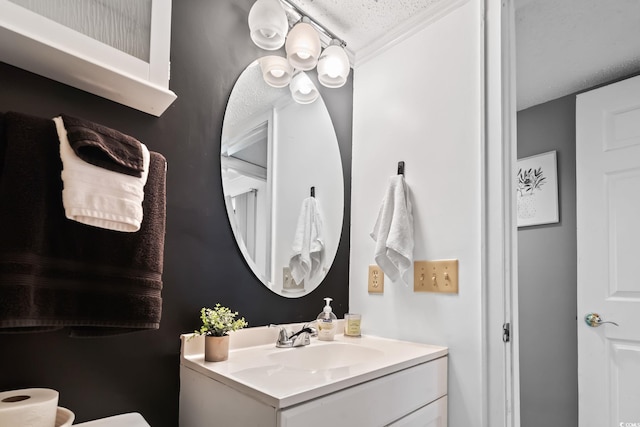 bathroom with vanity and a textured ceiling